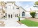 Home's backyard featuring turf, gravel and manicured desert landscaping at 9004 Crystal Glass Dr, Las Vegas, NV 89117