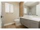 Modern bathroom with sleek vanity, vessel sink, and stylish mirror with wood accent at 9004 Crystal Glass Dr, Las Vegas, NV 89117