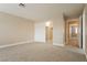Carpeted bedroom with closet featuring folding doors, and a door leading to another room at 9004 Crystal Glass Dr, Las Vegas, NV 89117