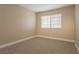 Bedroom features carpet, neutral walls, and a window providing natural light at 9004 Crystal Glass Dr, Las Vegas, NV 89117