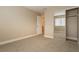 Bedroom with carpet, closet with mirrored doors, and a connecting door at 9004 Crystal Glass Dr, Las Vegas, NV 89117