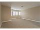 Spacious bonus room filled with natural light, featuring neutral carpet and walls at 9004 Crystal Glass Dr, Las Vegas, NV 89117