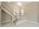 Entryway featuring light-colored walls, staircase, and modern flooring at 9004 Crystal Glass Dr, Las Vegas, NV 89117