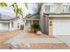 Charming home featuring desert landscaping, a two car garage, and quaint porch at 9004 Crystal Glass Dr, Las Vegas, NV 89117