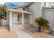 Inviting front porch and walkway to the front door, set against desert landscaping at 9004 Crystal Glass Dr, Las Vegas, NV 89117