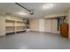 This garage has an epoxy floor, shelving, and plenty of room for parking and storage at 9004 Crystal Glass Dr, Las Vegas, NV 89117