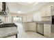 This kitchen has granite countertops, stainless steel appliances, and access to the backyard at 9004 Crystal Glass Dr, Las Vegas, NV 89117