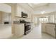 This kitchen has granite countertops, stainless steel appliances, and access to the backyard at 9004 Crystal Glass Dr, Las Vegas, NV 89117