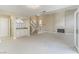 Inviting living room includes a fireplace, wet bar, staircase and stylish modern flooring at 9004 Crystal Glass Dr, Las Vegas, NV 89117