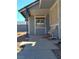 A welcoming covered entrance that features neutral tones and simple design at , Las Vegas, NV 89122