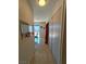 Well-lit hallway with stylish flooring, closets, and access to the backyard area at , Las Vegas, NV 89122