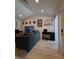 Bright living room featuring a vaulted ceiling and a modern workspace at , Las Vegas, NV 89122