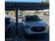 Carport view featuring parked cars in a community setting at , Las Vegas, NV 89122