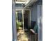 A cozy outdoor patio featuring a black chair, small marble table, and decorative string lights at , Las Vegas, NV 89122