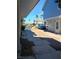 Neighborhood street view featuring townhouses, sidewalks, and palm trees under a clear blue sky at , Las Vegas, NV 89122