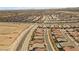 Expansive aerial view of a Primary-planned community with meticulously designed homes and desert landscaping at 10158 Super Jovian St, Las Vegas, NV 89143