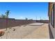 The backyard features a custom patio and ample space for outdoor enjoyment and entertaining at 10158 Super Jovian St, Las Vegas, NV 89143