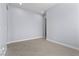 Empty bedroom with large tile flooring and neutral gray walls with white trim at 10158 Super Jovian St, Las Vegas, NV 89143