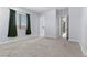 Spacious, carpeted bedroom with large window and access to other rooms in the house at 10158 Super Jovian St, Las Vegas, NV 89143