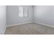 Clean, neutral bedroom with carpet and a window letting in natural light at 10158 Super Jovian St, Las Vegas, NV 89143