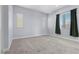 Neutral carpeted bedroom with natural light highlighting the calming ambiance at 10158 Super Jovian St, Las Vegas, NV 89143