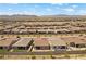 An aerial view shows the homes in the area and the surrounding landscape at 10158 Super Jovian St, Las Vegas, NV 89143
