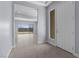 Bright entryway featuring neutral tile flooring, a modern door, and an open view to the living area and backyard at 10158 Super Jovian St, Las Vegas, NV 89143