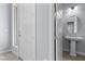 Charming entryway features a half bath and a large door with sidelight window at 10158 Super Jovian St, Las Vegas, NV 89143