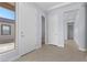 Bright foyer with tile flooring leads to multiple rooms, showcasing the home's open layout at 10158 Super Jovian St, Las Vegas, NV 89143