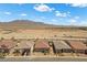 Street view of homes in the community with desert and mountain views at 10158 Super Jovian St, Las Vegas, NV 89143