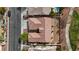 Aerial view of the property showcasing its tile roof, landscaping, and proximity to the street at 10563 Sunblower Ave, Las Vegas, NV 89135