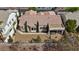 Aerial view showcasing the home's tile roof, backyard patio, and well-maintained landscaping at 10563 Sunblower Ave, Las Vegas, NV 89135