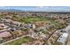 Community aerial view with playground, baseball diamond, and tree-lined walking paths for recreation at 10563 Sunblower Ave, Las Vegas, NV 89135
