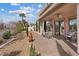 Outdoor patio area perfect for relaxing with a seating area and minimal backyard at 10563 Sunblower Ave, Las Vegas, NV 89135