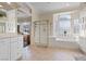 Beautiful bathroom with glass shower, soaking tub, and large window for natural light at 10563 Sunblower Ave, Las Vegas, NV 89135