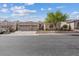 Charming single-story home with a three-car garage and well-manicured front yard at 10563 Sunblower Ave, Las Vegas, NV 89135