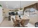 Eat in kitchen featuring tile floors, white cabinets, and ample counter space at 10563 Sunblower Ave, Las Vegas, NV 89135