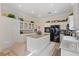 Modern kitchen featuring white cabinets, granite countertops, an island, and stainless steel appliances at 10563 Sunblower Ave, Las Vegas, NV 89135