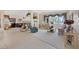 Spacious living room with a fireplace, large windows with lots of natural light, and neutral decor at 10563 Sunblower Ave, Las Vegas, NV 89135