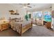 Spacious main bedroom with large windows, TV, and neutral decor at 10563 Sunblower Ave, Las Vegas, NV 89135