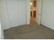 This bedroom features neutral walls, carpet flooring, and a sliding-door closet at 11039 Pegasus Dr, Las Vegas, NV 89135
