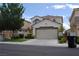 Charming two-story home featuring a well-manicured front yard and an attached two-car garage at 11039 Pegasus Dr, Las Vegas, NV 89135