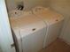 This laundry room features a washing machine and dryer for tenant convenience at 11039 Pegasus Dr, Las Vegas, NV 89135