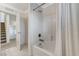 Bathroom showcasing a shower over tub, with tile surround and tile floors at 134 Lomita Heights Dr, Las Vegas, NV 89138