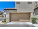 Attached two-car garage in a modern townhouse, providing convenient parking and storage at 134 Lomita Heights Dr, Las Vegas, NV 89138