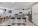 Stylish open-concept kitchen with a granite island, stainless steel appliances, and ample cabinet space at 134 Lomita Heights Dr, Las Vegas, NV 89138