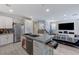 Bright living room featuring an open layout, modern decor, and stainless steel appliances at 134 Lomita Heights Dr, Las Vegas, NV 89138
