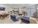 Bright and open living room with modern decor, seamlessly connecting to the kitchen and dining areas at 134 Lomita Heights Dr, Las Vegas, NV 89138