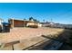 Backyard with brick paver area and trash can at 1805 Helen Ave, North Las Vegas, NV 89032