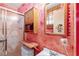 Small bathroom featuring a shower, toilet, and sink with cabinet storage at 1805 Helen Ave, North Las Vegas, NV 89032